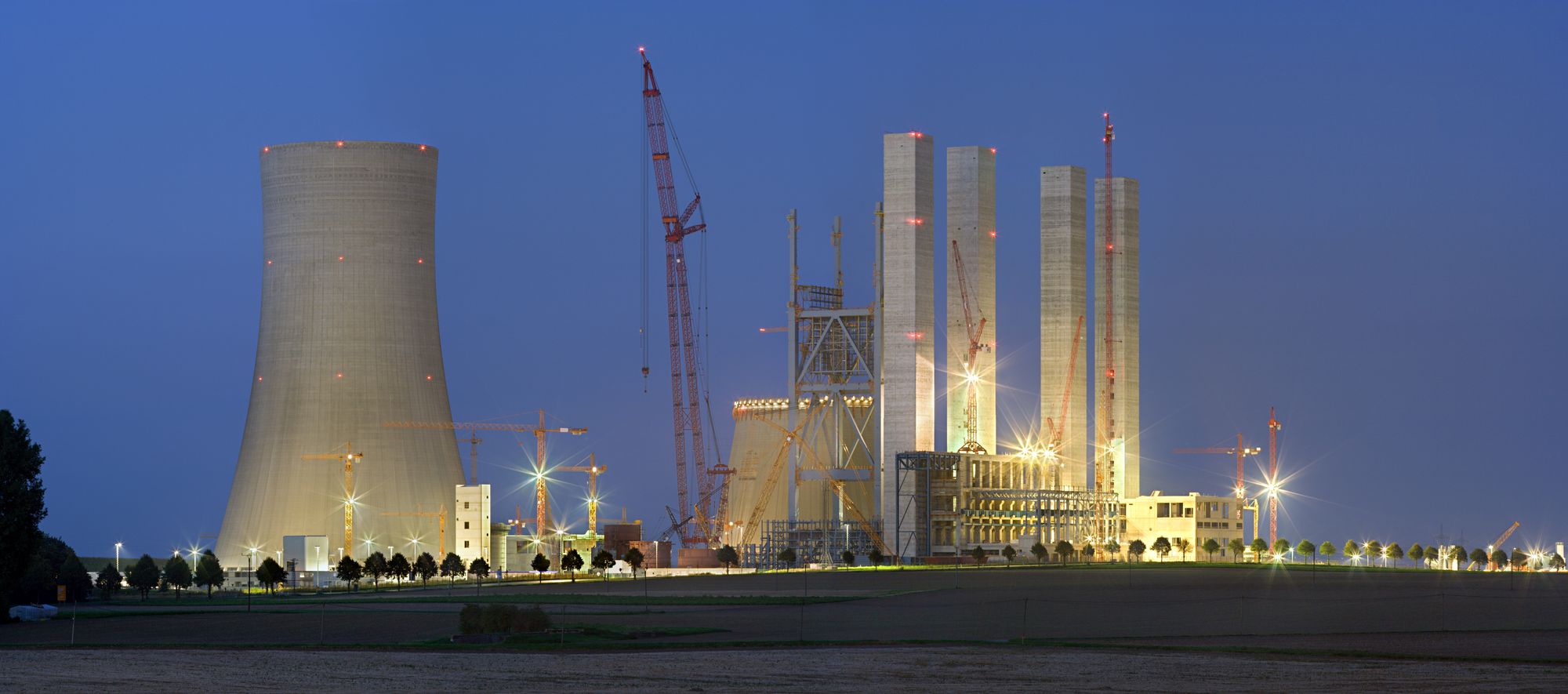 Power station construction site lit at night